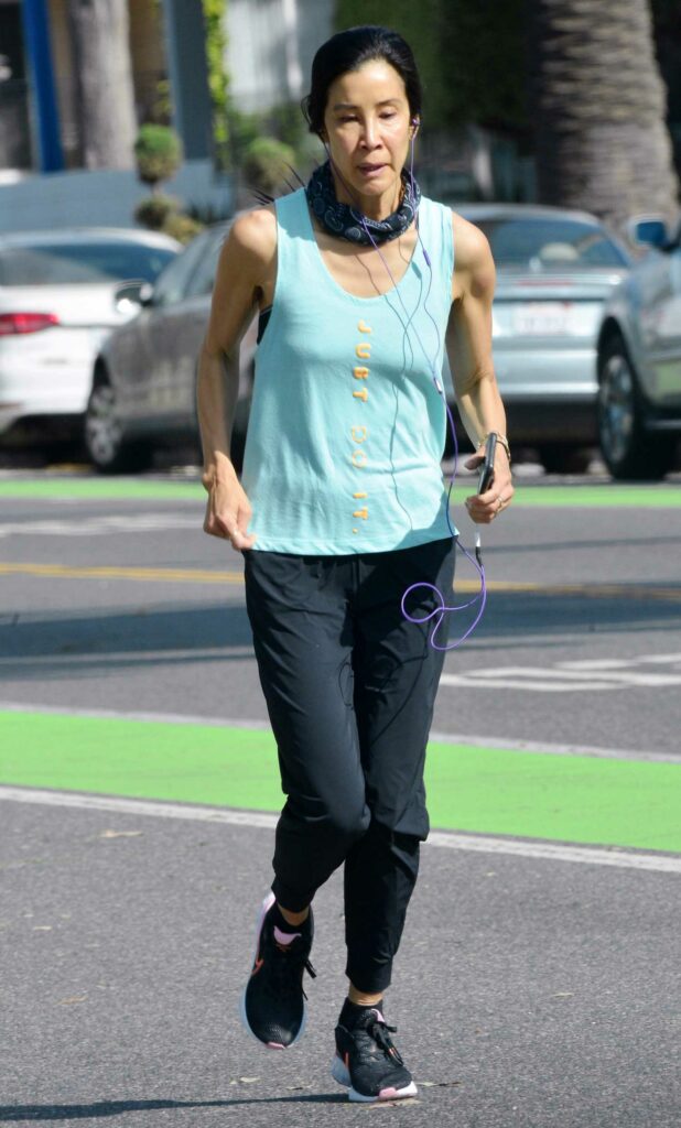 Lisa Ling in a Blue Tank Top