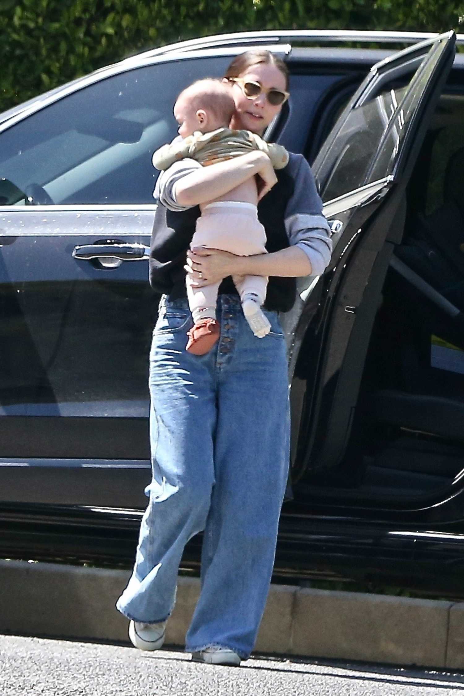 Rooney Mara in a Blue Jeans Arrives at Her Sister's House with Her Baby