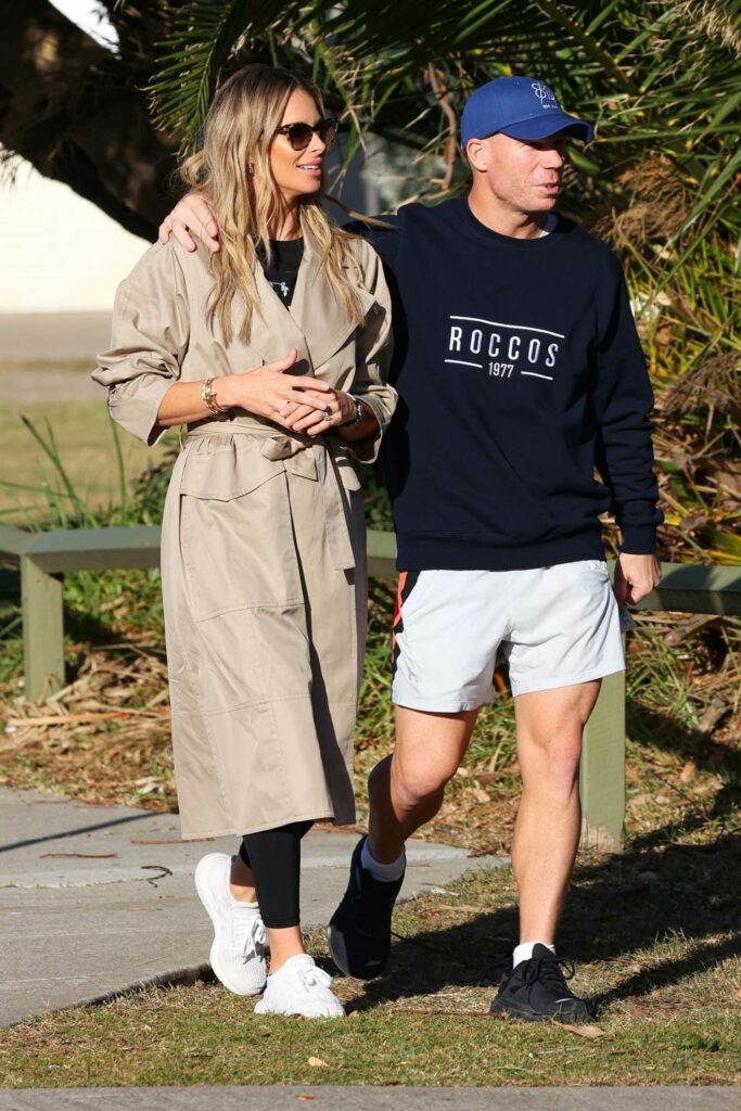 Candice Warner in a Beige Trench Coat