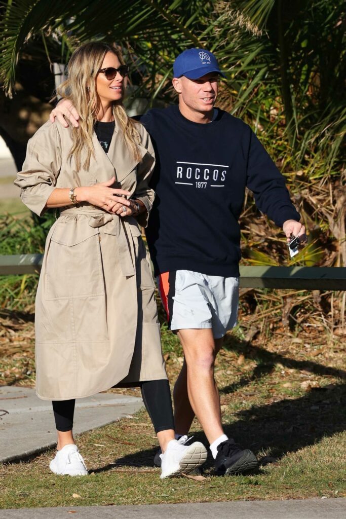 Candice Warner in a Beige Trench Coat