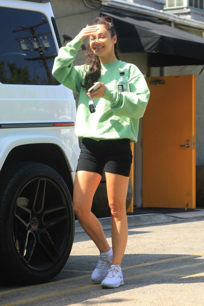Cara Santana in a Green Sweatshirt