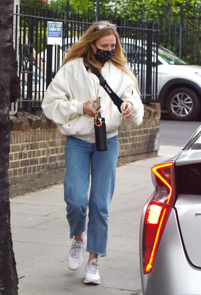 Clara Paget in a White Bomber Jacket