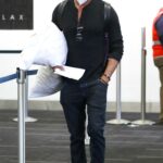 Josh Duhamel in a Black Cap Arrives at LAX Airport in Los Angeles