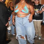 Lizzo in a Blue Ripped Jeans Leaves Dinner with Friends at Catch LA in West Hollywood