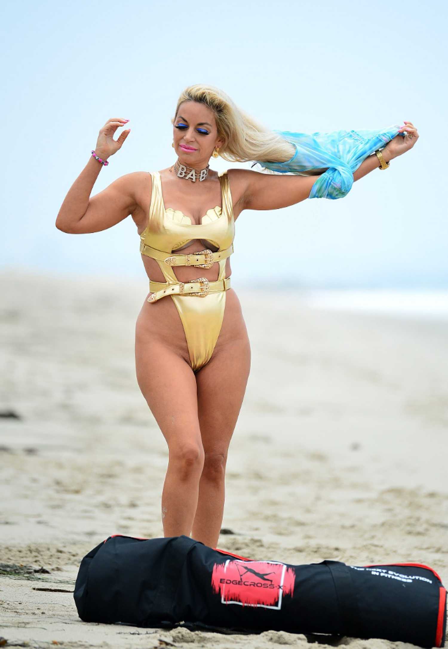 Marcela Iglesias in a Gold Bikini Does a Workout Session on the Beach in  Malibu – Celeb Donut