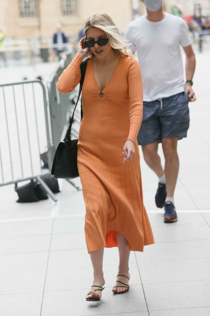 Mollie King in an Orange Dress