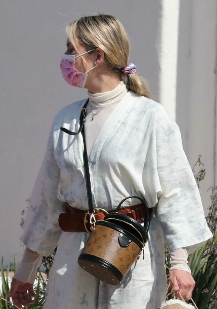 Tamara Ecclestone in a Pink Protective Mask