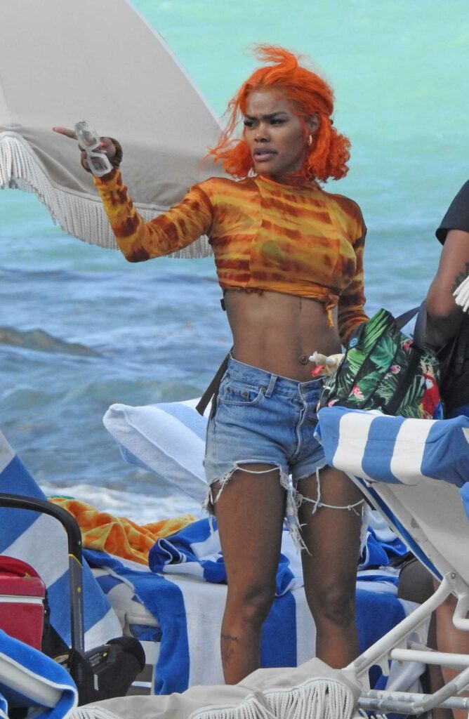 Teyana Taylor in an Orange Top