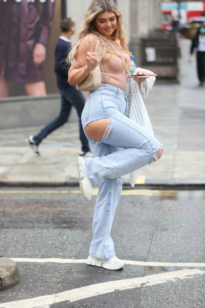 Belle Hassan in a Blue Ripped Jeans