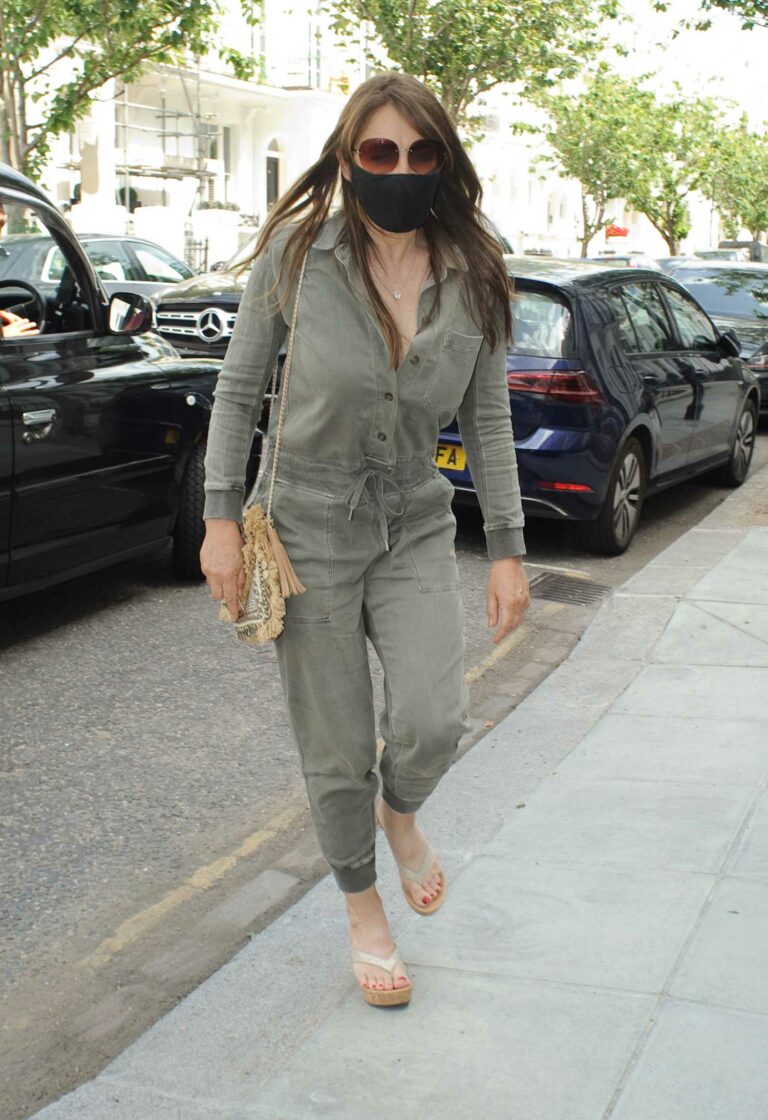 Elizabeth Hurley in an Olive Jumpsuit Arrives at Cambio De Tercio