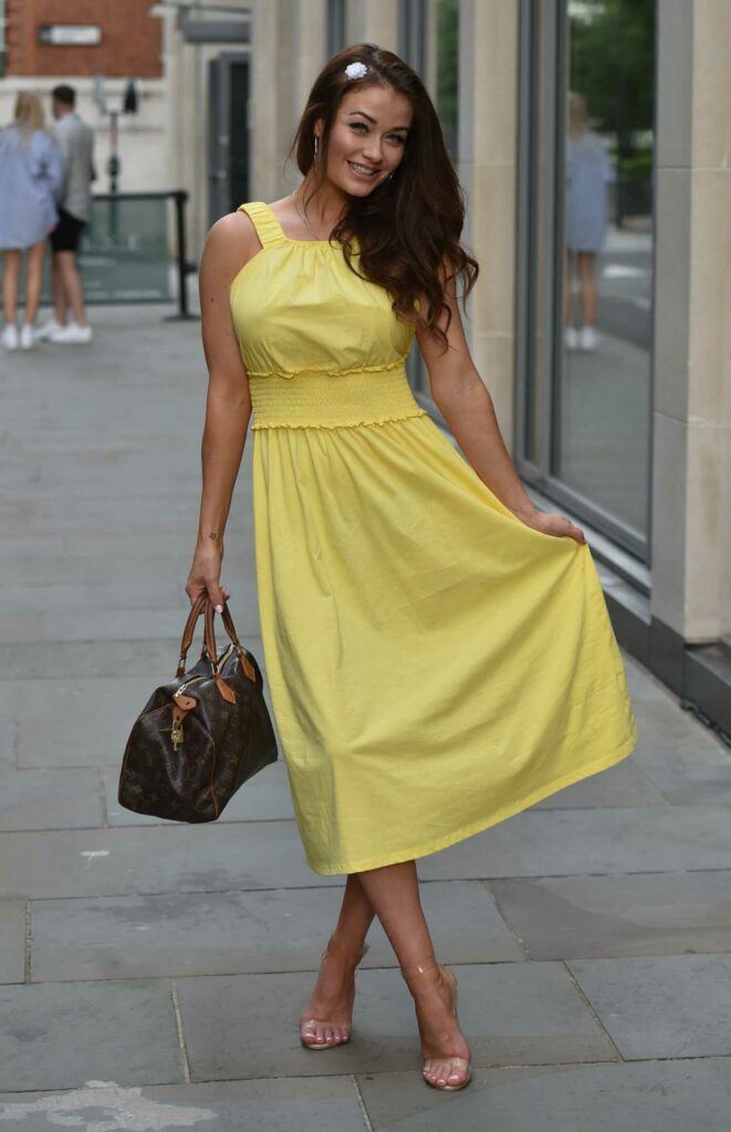 Jess Impiazzi in a Yellow Dress