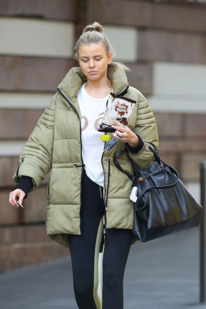Tegan Martin in an Olive Puffer Jacket