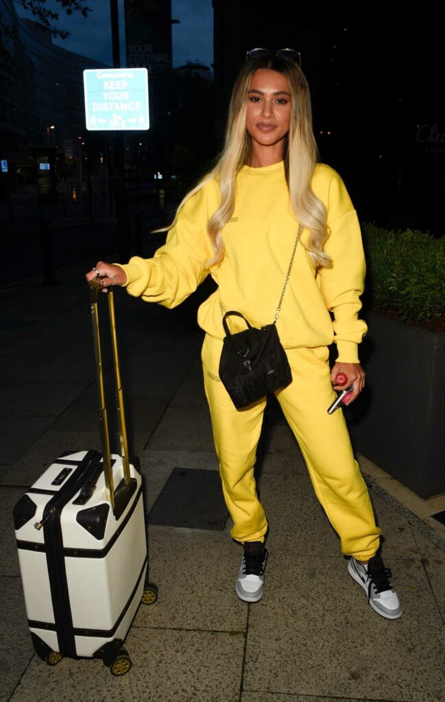 Joanna Chimonides in a Yellow Sweatsuit