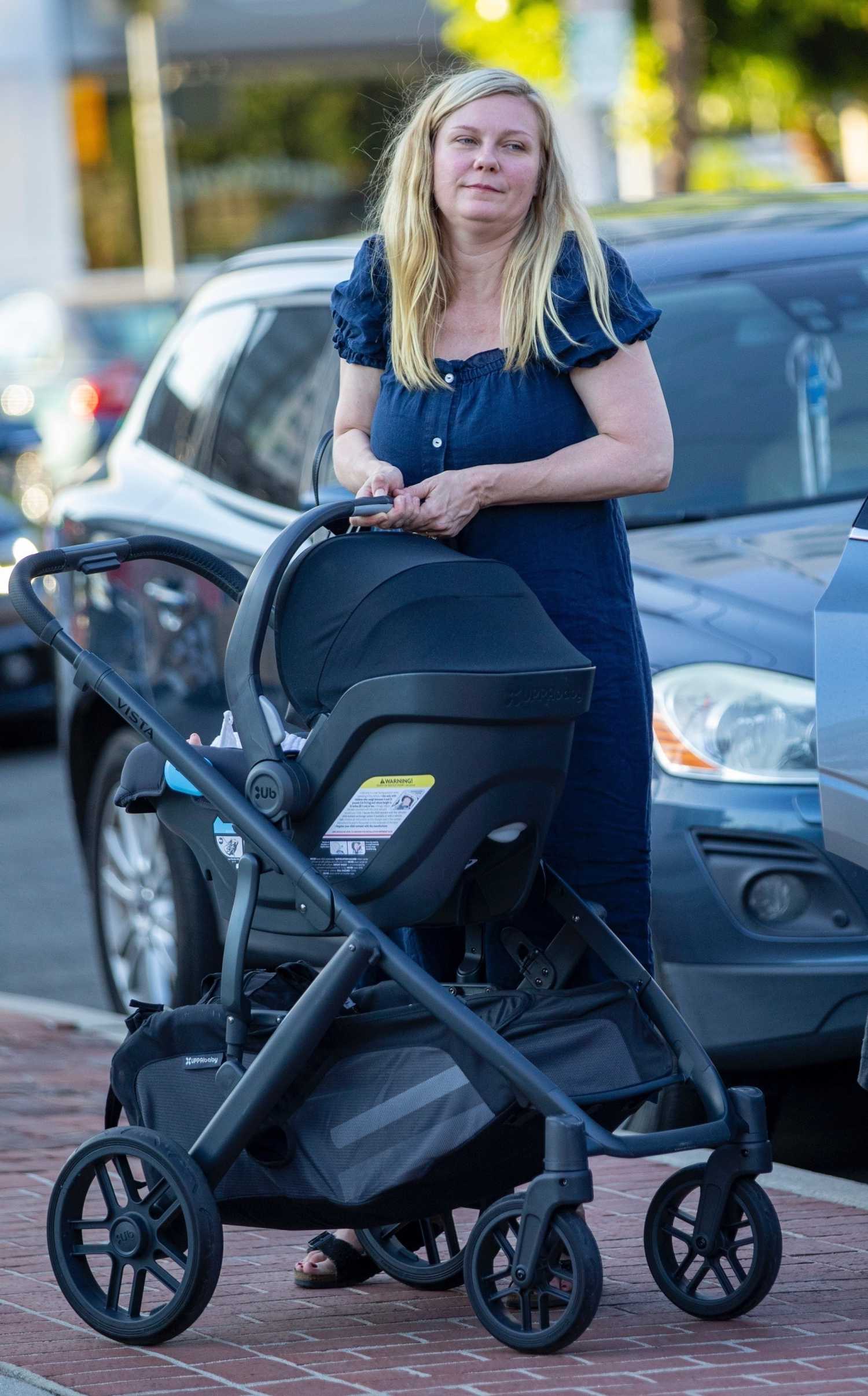 Kirsten Dunst in a Blue Dress Was Spotted Out with Her Two Kids in