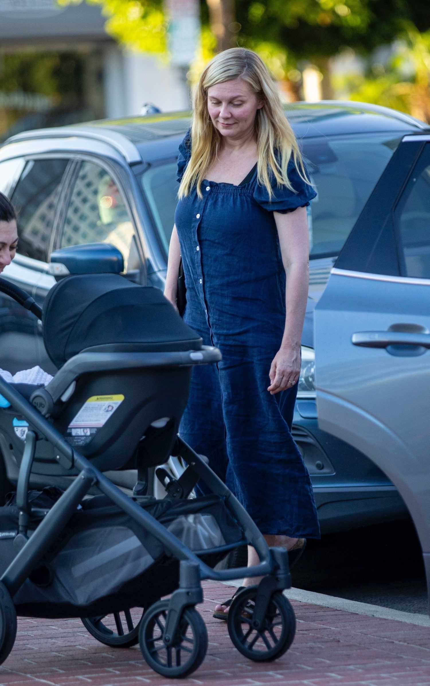 Kirsten Dunst in a Blue Dress Was Spotted Out with Her Two Kids in