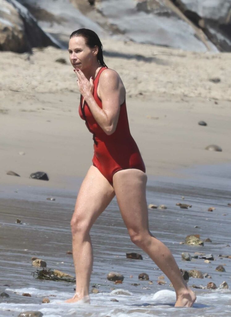 Minnie Driver in a Red Swimsuit