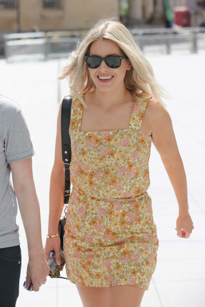 Mollie King in a Floral Mini Dress