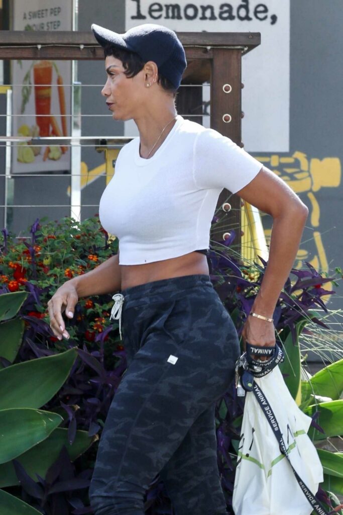 Nicole Murphy in a White Cropped Tee
