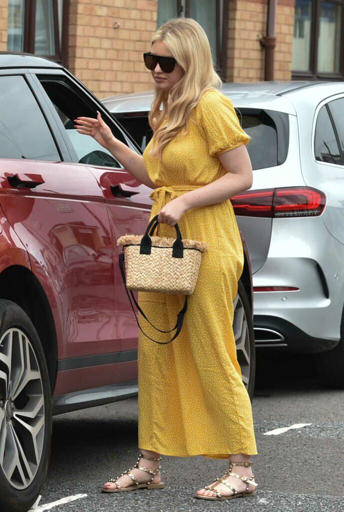 Amy Hart in a Yellow Polka Dot Jumpsuit