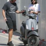 Gal Gadot in a White Tee Riding on the Back of a Motor Scooter with Her Husband in Tel Aviv