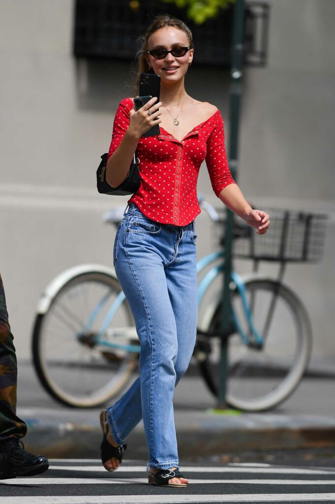 Lily-Rose Depp in a Red Blouse