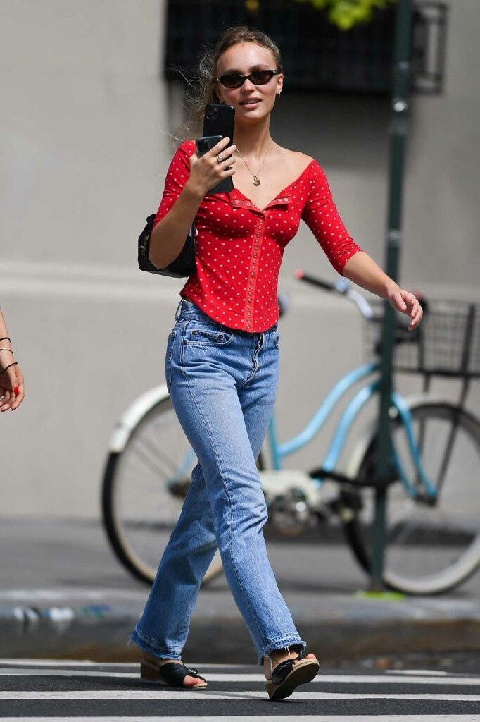 Lily-Rose Depp in a Red Blouse