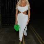 Amber Turner in a White Dress Arrives at the Siding Bar in London