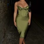 Chloe Brockett in an Olive Dress Arrives at the Siding Bar in London