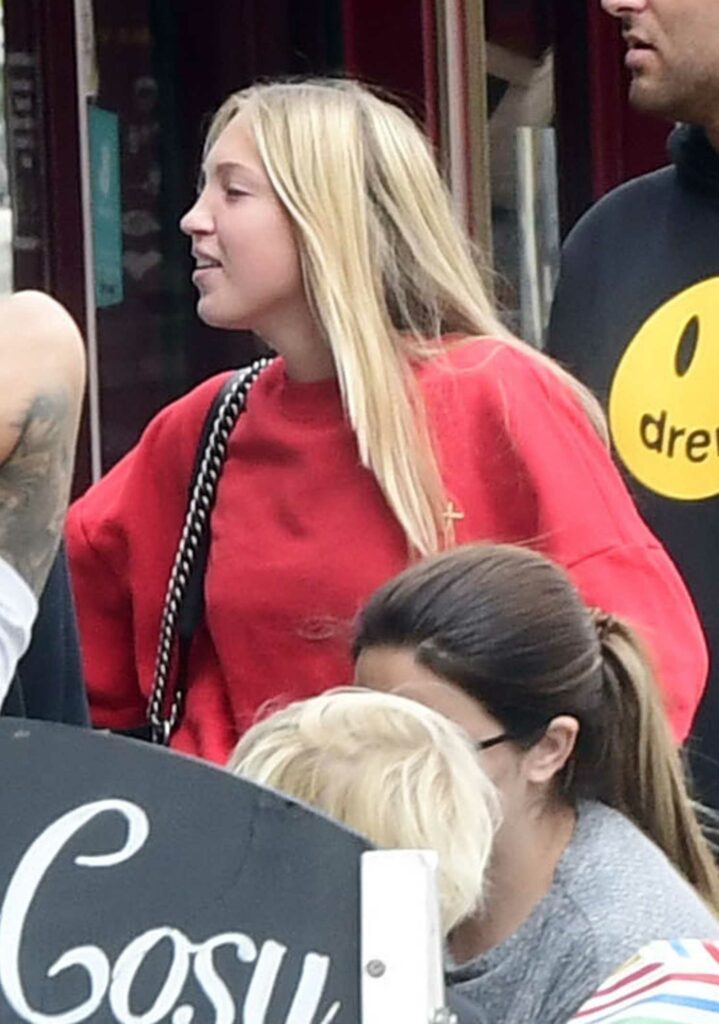 Lila Grace Moss in a Red Sweatsuit