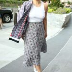 Rosalia in a White Tank Top Arrives at 2021 Thom Browne Fashion Show During NYFW in New York City