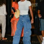 Tina Kunakey in a White Top Leaves Her Hotel in Milan