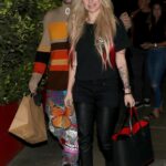 Avril Lavigne in a Black Tee Steps Out to Dinner with Mod Sun at Giorgio Baldi in Santa Monica
