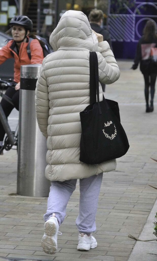 Charlotte Jordan in a Beige Puffer Jacket