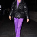 Chloe Ross in a Purple Pants Attends the Dungeons Halloween Launch Event in London