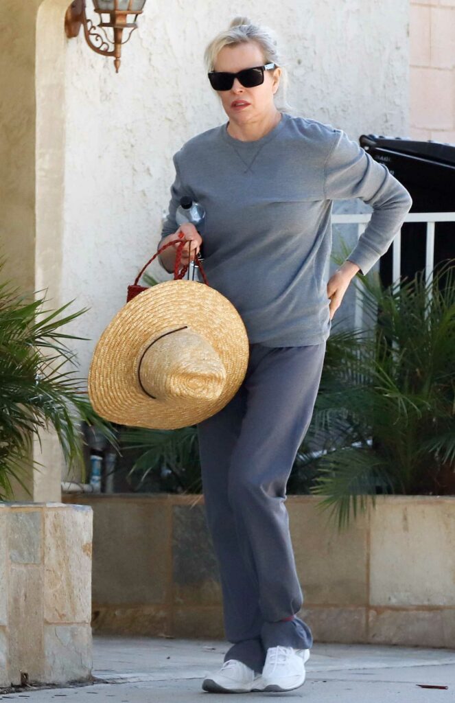 Kim Basinger in a Grey Sweatshirt