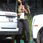 Kimora Lee Simmons in a Black Leggings Grabs an Iced Drink at Starbucks in Beverly Hills