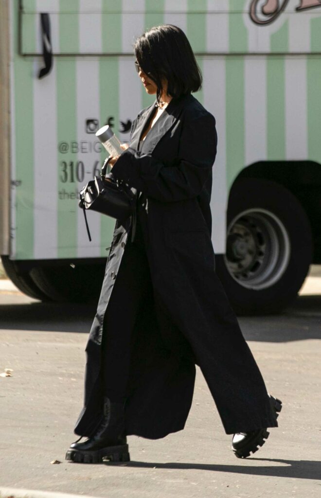 Kourtney Kardashian in a Black Trench Coat