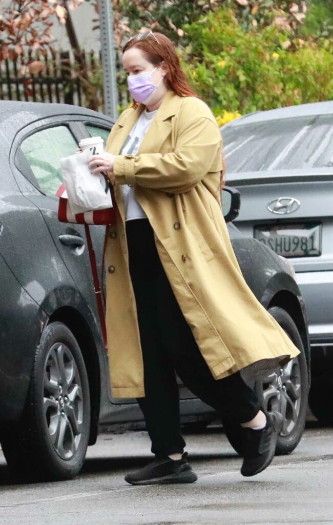 Lily Kershaw in a Yellow Trench Coat