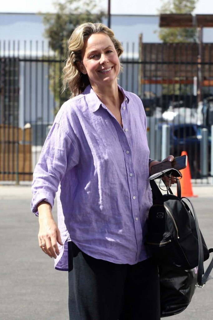 Melora Hardin in a Purple Shirt