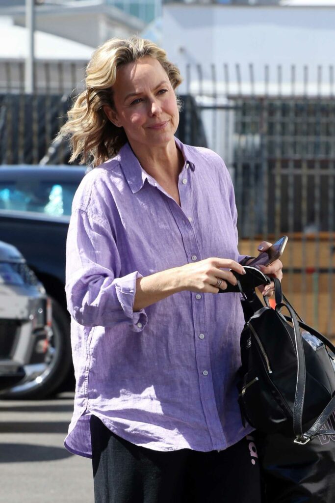 Melora Hardin in a Purple Shirt