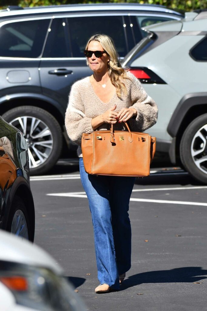 Molly Sims in a Beige Sweater