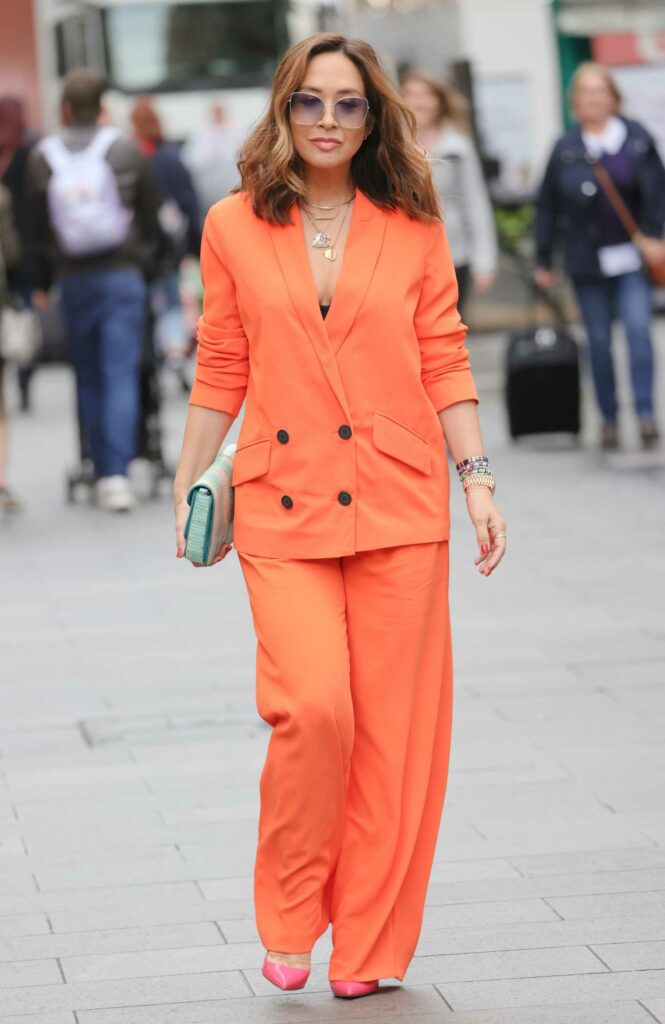 Myleene Klass in an Orange Pantsuit