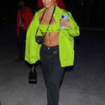Saweetie in a Neon Green Jacket Arrives to Los Angeles Lakers Basketball Game in LA