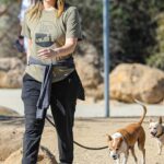 Alicia Silverstone in an Olive Tee Walks Her Dogs in Malibu