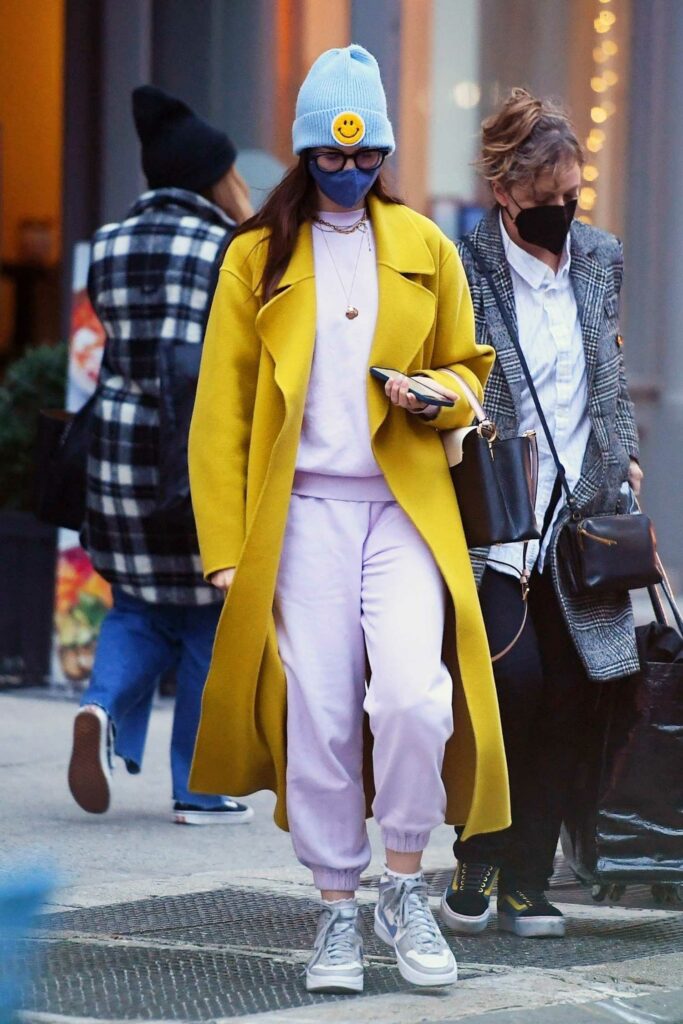 Anne Hathaway in a Yellow Trench Coat