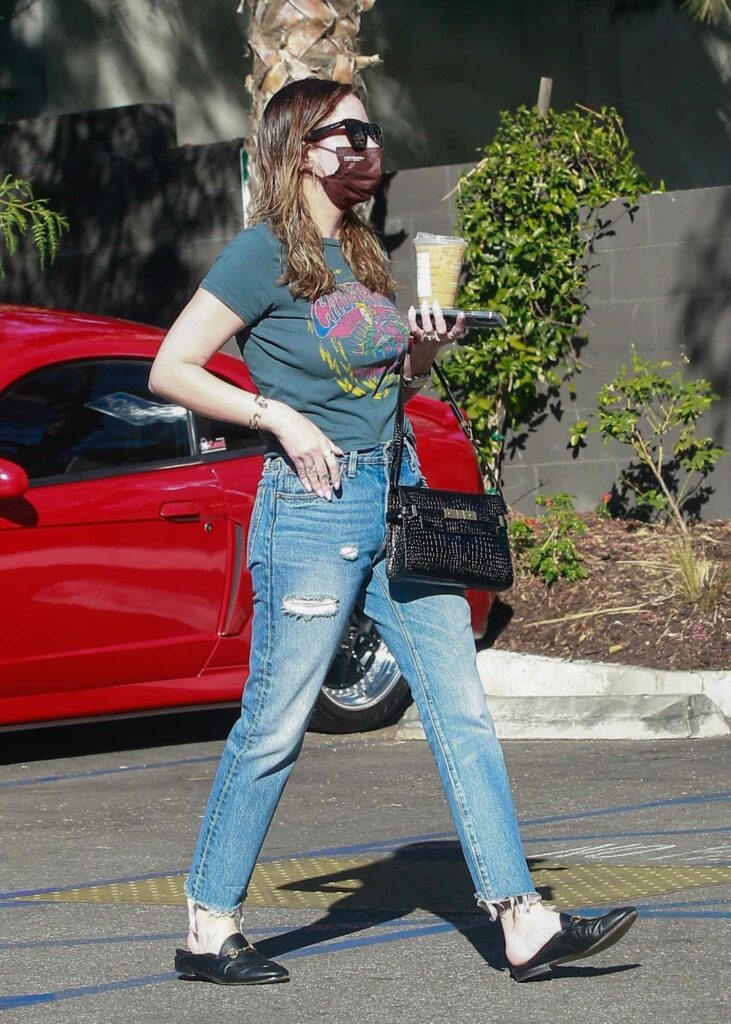 Ashley Benson in a Blue Ripped Jeans