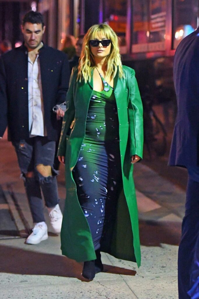 Bebe Rexha in a Green Leather Coat