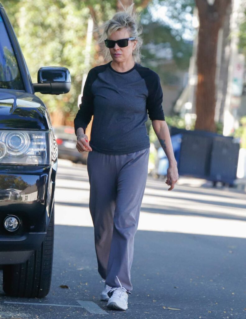 Kim Basinger in a White Sneakers