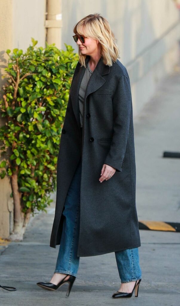 Kirsten Dunst in a Black Coat