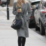 Laura Whitmore in a Black Cap Leaves Her BBC Radio Show in London
